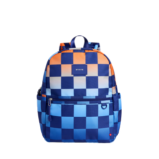 State Bags Kane Backpack - Gradient Checkerboard
A backpack with a blue and orange checkerboard pattern, featuring a front zippered pocket and a top handle, shown against a plain white background.