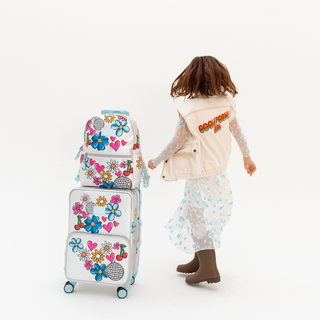 State Bags Logan carry-on suitcase with graffiti design, featuring durable construction and a compact size for travel.