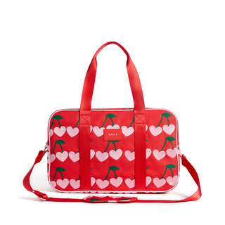 State Bags Rockaway Duffle in cherry red, showcasing the spacious design, sturdy handles, and stylish exterior of the travel bag.