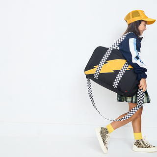 State Bags Rockaway Duffle with fuzzy bolt design, soft fabric exterior, and sturdy handles for travel and gym use.