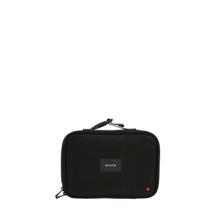 State Bags Rodgers Lunch Box - Black
A black zippered travel pouch with a top handle, featuring a central black label with the white text 'STATE' and a small red dot accent in the bottom right corner, set against a plain white background.