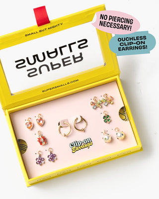 Super Smalls Absolutely Charming Clip On Earring Set 
Set of clip-on earrings in a yellow box with branding and product information.