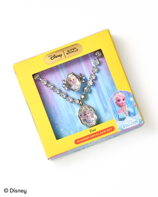 Super Smalls Disney Elsa Shaker Necklace Set
Disney Silver Shells Elsa Starter Necklace Set in its original yellow packaging, featuring a crystal-encrusted necklace with two oval pendants depicting Elsa and Anna.