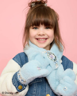 Super Smalls Disney Frozen Elsa Plush Scarf
Child wearing a blue fur scarf with decorative elements on a pink background