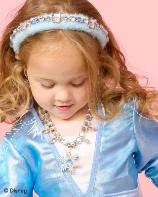 Super Smalls Disney Frozen Elsa Snowflake Sparkle Headband
Child in a blue costume with a tiara and necklace on a pink background