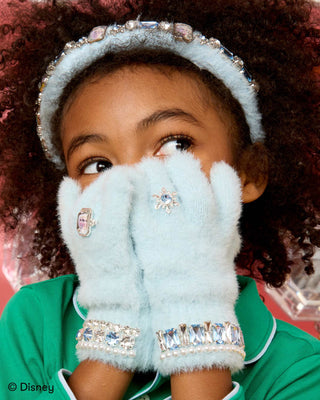Super Smalls Disney Frozen Elsa Winter Jeweled Gloves
Child wearing light blue mittens with decorative elements, green shirt, and Disney logo.