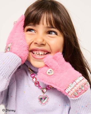 Super Smalls Disney Minnie Mouse Gloves
Child wearing pink gloves with decorative elements, smiling against a white background.