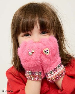 Super Smalls Disney Minnie Mouse Gloves
Child wearing pink fluffy gloves with decorative elements, against a plain background