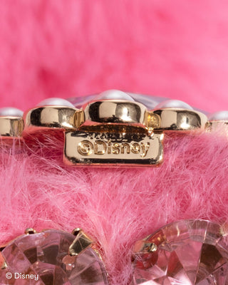 Super Smalls Disney Minnie Mouse Plush Scarf
Close-up of a pink handbag with gold accents and Disney logo on a pink background