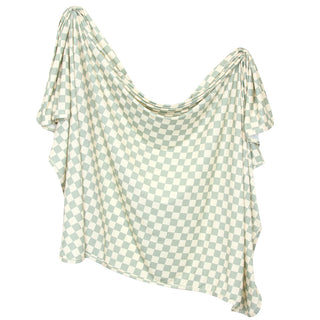 Lou Lou and Company Knit Swaddle Blanket in Kirby pattern with green and white swamp checkered design, soft and cozy for babies.