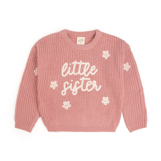 Sweet Wink Little Sister Knit SweaterPink sweater with 'little sister' text and flower patterns on a white background