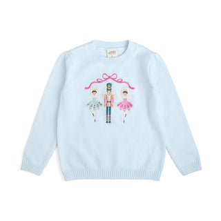 Sweet Wink embroidered Christmas sweater featuring a colorful nutcracker design on a festive knit sweater.