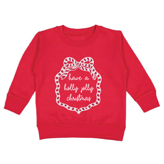 Sweet Wink Holly Jolly Christmas sweatshirt featuring a sequin bow patch and festive holiday design.