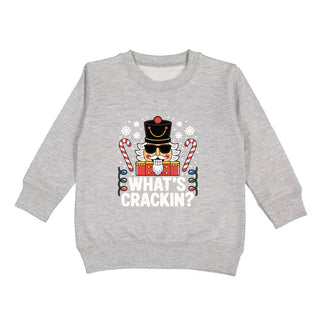 Sweet Wink What's Crackin Christmas sweatshirt, cozy holiday sweater with festive design and seasonal text.
