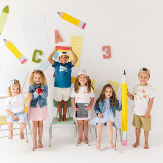 Sweet Wink Back To School
Children posing with large colorful pencils and letters on a white background