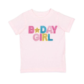 Sweet Wink Birthday Girl Rhinestone Patch Short Sleeve T-Shirt
Pink t-shirt with 'B-Day Girl' text in colorful letters on a white background