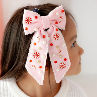 Sweet Wink Candy Cane Christmas gemstone bow clip featuring a festive red and white candy cane design with sparkling gemstones.