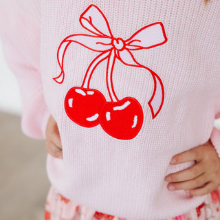 Sweet Wink Cherry Coquette Knit Sweater
Pink sweater with red cherries and bow design