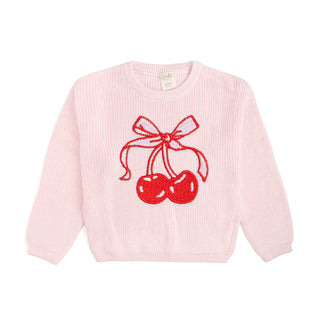 Sweet Wink Cherry Coquette Knit Sweater
Pink sweater with red cherries and bow design on a white background