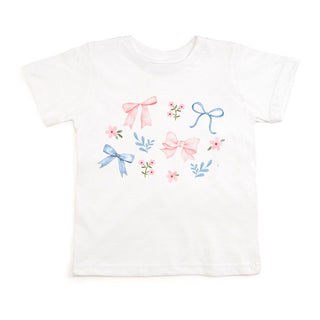 Sweet Wink Floral & Bow Watercolor Short Sleeve T-Shirt - White
White t-shirt with colorful bow designs on a white background