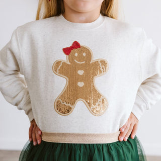 Sweet Wink Gingerbread Sequin Patch Christmas Sweatshirt - Natural
Child wearing a sweater with a gingerbread man design on a plain background