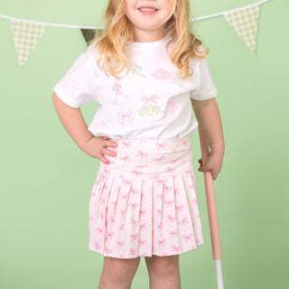 White Sweet Wink golf icon short sleeve T-shirt featuring a subtle golf-themed design, worn by a model.