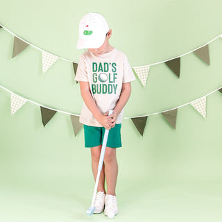 White baseball hat by Sweet Wink with a golf tee front flag patch, showcasing a casual and sporty style.