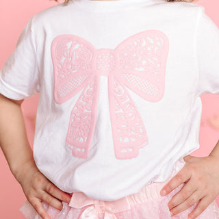 Sweet Wink Lace Bow Puff Ink Short Sleeve T-Shirt - White
White shirt with pink bow design worn by a child on a pink background