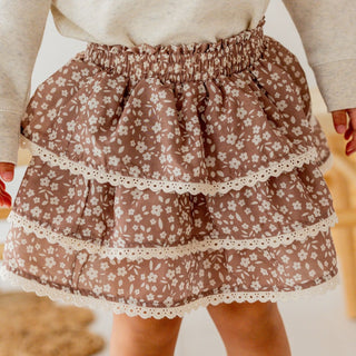 Sweet Wink Mocha Floral Skort
Brown floral skirt with lace trim worn by a person.