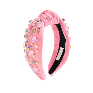 Sweet Wink Pastel Gemstone Headband
Pink headband with decorative beads and pearls on a white background