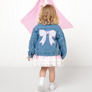 Sweet Wink Pearl and Gemstone Floral Bow Patch Denim Jacket
Child wearing a denim jacket with a large bow design on the back, standing against a white background.