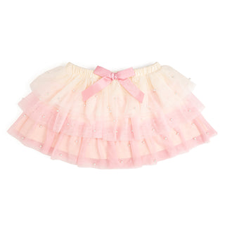 Sweet Wink Pretty Pearl Petal Tutu
Pink tutu skirt with a bow on a white background