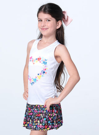 Lucky In Love Thumbprint Hearts Tank
Young girl wearing a white tank top with colorful heart designs and a multicolored skirt on a white background