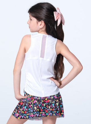 Lucky In Love Thumbprint Hearts Tank
Young girl wearing a white sleeveless top and colorful skirt on a white background