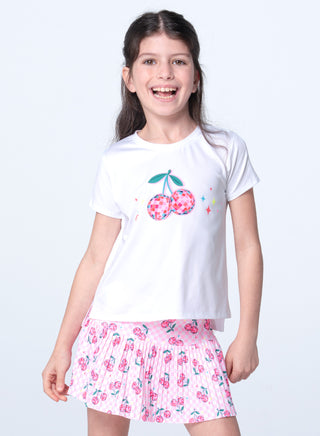 Lucky In Love Short Sleeve Tee - Disco Cherry
Young girl wearing a white t-shirt with cherry design and a pink skirt with floral pattern on a white background