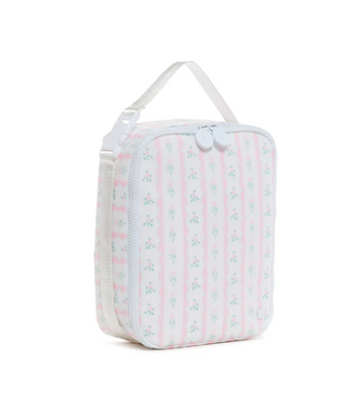 TRVL Designs Lunch Box Insulated Lunch Bag - Ribbon Floral Pink A small rectangular zippered lunch bag or toiletry case with a white handle, featuring vertical pink stripes and a repeating light blue floral pattern, shown on a plain white background.