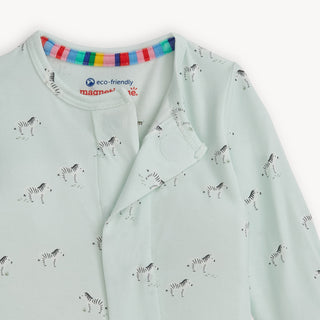 Magnetic Me Teal Savannah Plains Modal Footie
Light blue baby onesie with zebra pattern and rainbow collar on a white background
