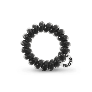 Teleties Jet Black Hair Ties - Tiny
Black hair tie with a visible brand logo on a transparent background