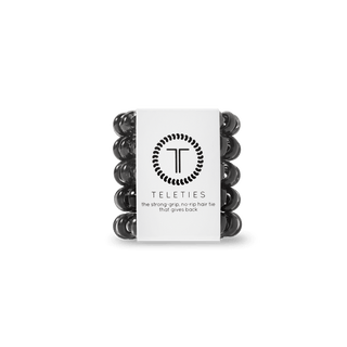 Teleties Jet Black Hair Ties - Tiny
Stack of black hair ties with a Teleties label on a transparent background