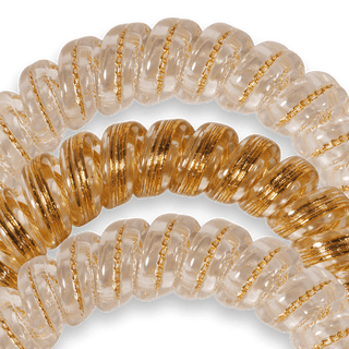 Teleties Luxury Living Hair Ties - Large
Close-up of two gold and white beaded bracelets on a clear background