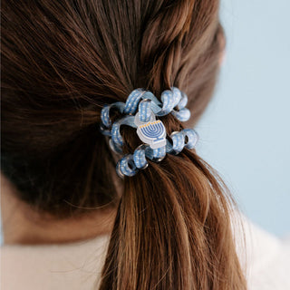 Teleties Spiral Hair Coils Mix Pack: Drop It Like a Dreidel Mix Pack Hair Ties
Blue hair tie with a star design in a person's hair against a light blue background