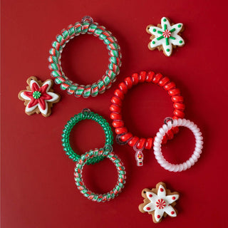 Teleties Spiral Hair Coils Mix Pack: You Crack Me Up Hair Ties
Colorful spiral hair ties with decorative cookies on a red background