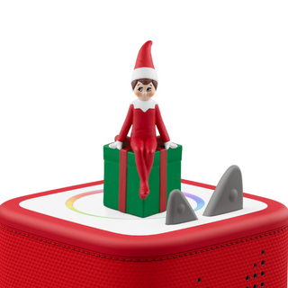 Tonies Character: The Elf on the Shelf
Elf on the Shelf figurine on a red toy with shark fins on a white background