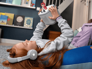 Tonies Bluetooth Headphones: Moon Gray
Child playing with a toy VR headset in a home setting