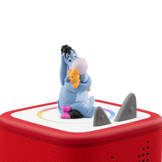 Tonies Character - Disney Winnie the Pooh: Eeyore
Eeyore figurine with a rainbow and shark fin on a red surface