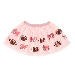 The Coquette Football Sequin Tutu is a fun skirt and dress up tutu for celebrating Game Day!

Features:

Ballet pink tulle and cotton lining
Brown and white sequin footballs and pink sequin bows
Pink glitter elastic waistband
Care: Hand wash and line dry
The Sweet Wink difference:

Super soft tulle that doesn’t scratch or itch
Cotton lining provides extra coverage and comfort
“Shed-free” embellishments ensure glitter does not sprinkle arouPink tutu skirt with sequin bow and cup designs on a white background