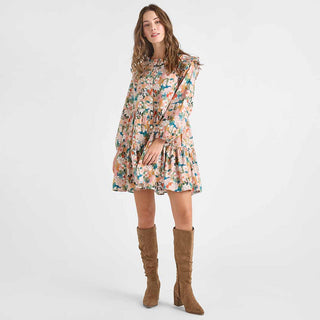 Pink Chicken Womens Kalani Dress - Watercolor Floral Woman wearing a floral dress and brown knee-high boots on a white background