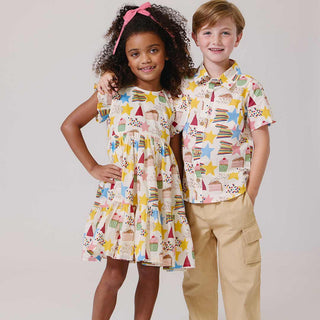 Pink Chicken Girls Jennifer Dress - Birthday Star Pink Chicken Girls Jennifer Dress - Birthday Star Two children wearing matching patterned outfits on a plain background