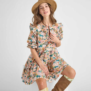 Pink Chicken Womens Kalani Dress - Watercolor Floral Woman wearing a floral dress and brown hat on a white background