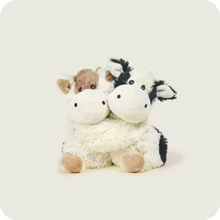 Warmies Cow HUGS
Two plush toys, one resembling a horse and the other a cow, sitting together on a light background.